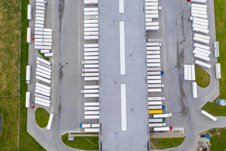 Aerial view of goods warehouse. Logistics delivery; center in industrial city zone from above....