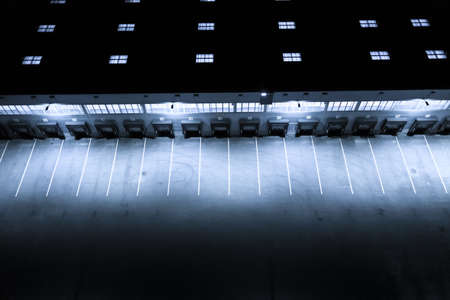 Aerial view of goods warehouse at Night. Logistics center in industrial city zone from above. Aerial...