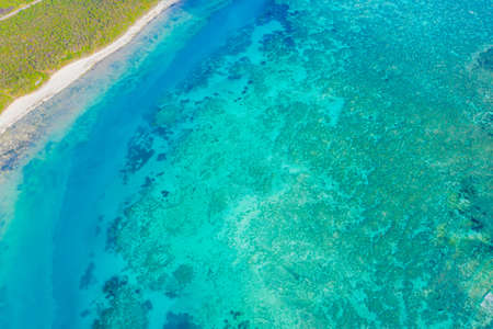 Aerial view to ocean waves. Blue water background. Dramatic colors photo.