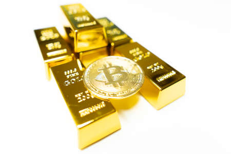 Bitcoin gold coin with golden bars. Cryptocurrency concept. Virtual currency. Bitcoin as desirable as gold conceptの写真素材