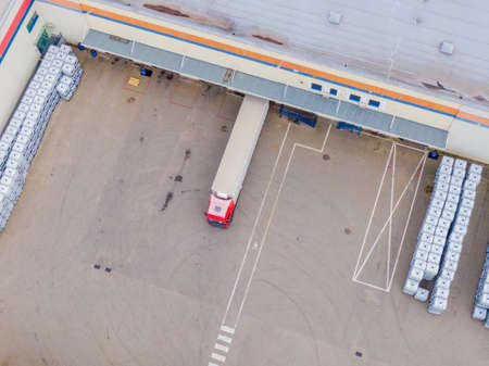 Aerial view of goods warehouse. Logistics center delivery in industrial city zone from above. Aerial...