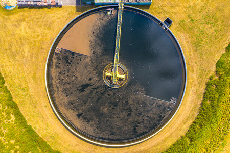 Aerial view of modern water cleaning facility at urban wastewater treatment plant. Purification process of removing undesirable chemicals, suspended solids and gases from contaminated liquidの写真素材