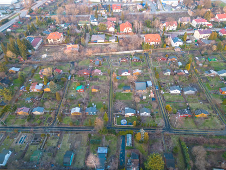 Aerial view of residential houses at spring . neighbourhood, suburb. Real estate, drone shots, sunset, sunlight, from above.の写真素材