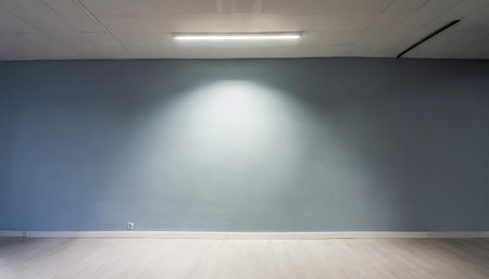 Blank light wall and white floor in empty hall room with led light on top. Mockupの素材