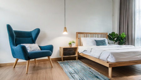 Scandinavian interior of bedroom concept design,blue lounge chair with wood bedside table and white bed on white wall,empty room,3d renderingの素材