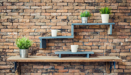 wooden plank shelf with black brick wall backgroundの素材