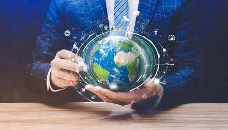 hands of a african american child holding crystal glowing globe planet earth at a sunny green meadow background copyspace taking care ecology sustainable nature conversation concept ai generatedの素材