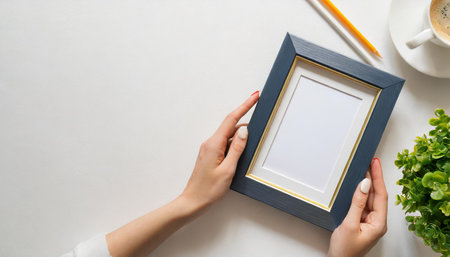 Young pretty woman hold blank canvas with empty mockup copy space. Minimal art concept.の素材