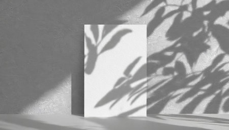 vertical sheets of textured white paper against a soft gray table background. the natural light creates subtle shadows from an exotic plant, enhancing the mockup overlay in a horizontalの素材