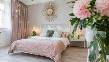 bedroom interior with bed and big indoor flowerの素材