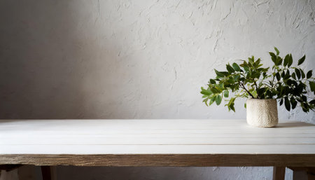 A minimalist white wooden table against a seamless white wall, ideal for product displays, promotional content, and marketing visuals. Perfect for clean, professional, and modern layouts.の素材