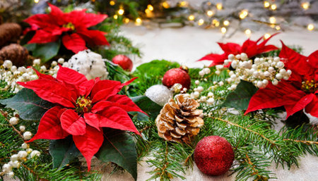 Celebrate the joy of the holidays with this stunning Christmas decoration image featuring a festive frame of vibrant red poinsettia flowers and elegant green Christmas tree branches, evokingの素材