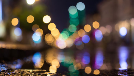 A stunning visual of multi-colored neon lights casting their glow across a dark urban street, with reflections dancing in puddles and on wet asphalt, capturing a vivid, cinematic cityscape atの素材