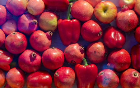 red pomegranates and apples backgroundの写真素材
