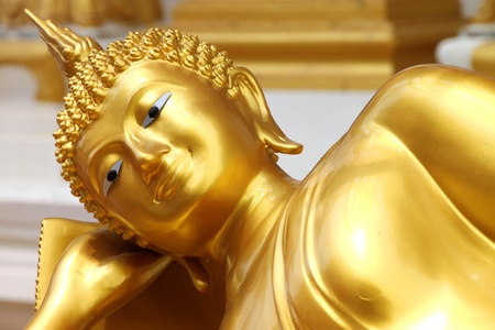 Reclining Buddha image in front of church, Wat Naga Wichai, Mahasarakam, Thailandの写真素材