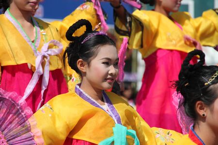 PAYAKKAPHUMPHISAI, MAHASARAKHAM - DECEMBER 17 : The unidentified Thai school girl is performing her modern dance outdoor One Tambol One Product (OTOP) festival season on December 17, 2011 at district hall plaza, Payakkaphumphisai, Mahasarakham.のeditorial素材