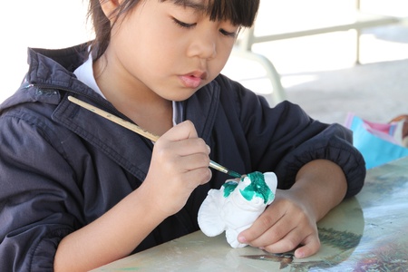 BORABUE, MAHASARAKHAM - DECEMBER 28 : The unidentified girl is in painting contest in a happy new year grand opening and festival on DECEMBER 28, 2011 at sports ground, Borabue, Mahasarakham, Thailand.のeditorial素材