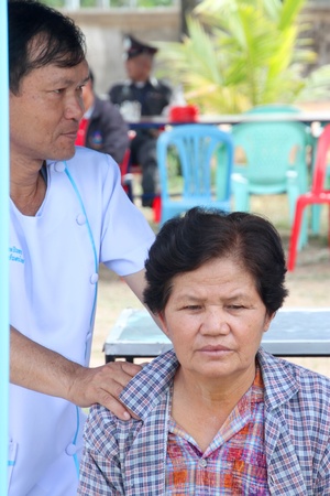 BORABUE, MAHASARAKHAM, THAILAND - JANUARY 19 : The unidentified woman has a massage service on January 19, 2012 at Wat Dong Keng, Borabue, Mahasarakham, Thailand.のeditorial素材