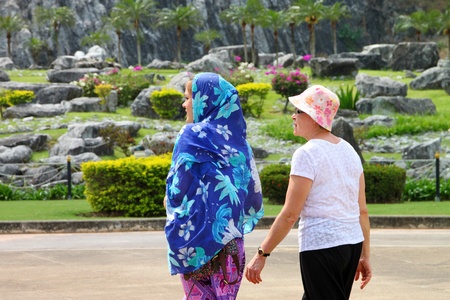 CHON BURI, THAILAND - FEBRUARY 2 : The unidentified tourists are traveling to Buddhist sanctuary on February 2, 2012 at Khao Chee Yan Mountain Buddha, Chon Buri, Thailand.のeditorial素材