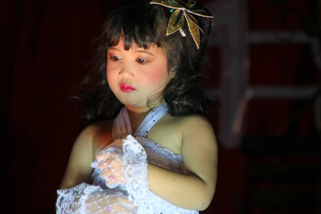 PAYAKKAPHUMPHISAI, MAHASARAKHAM, THAILAND - MARCH 11 : The unidentified pupil is performing modern dance in the end of semester Iam Suk school party on March 11, 2012 at city hall plaza, Payakkaphumphisai, Mahasarakham, Thailand.のeditorial素材