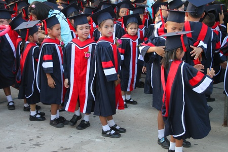 PAYAKKAPHUMPHISAI, MAHASARAKHAM, THAILAND - MARCH 11 : The unidentified children are waiting for school graduation on March 11, 2012 at city hall plaza, Payakkaphumphisai, Mahasarakham, Thailand.のeditorial素材