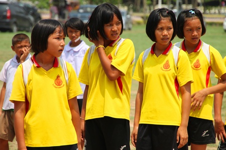 NACHUAK, MAHASARAKHAM, THAILAND - MARCH 21 : The unidentified children are working out on March 21, 2012 at Nong Bua Daeng School playground, Nachuak, Mahasarakham, Thailand.のeditorial素材