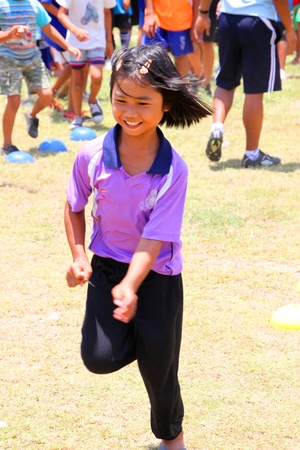 NACHUAK, MAHASARAKHAM - APRIL 18 : Unidentified girl is in football training clinic on April 18, 2012 at city hall playground, Nachuak, Mahasarakham, Thailand.のeditorial素材