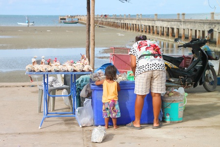 CHANTA BURI, THAILAND - APRIL 22 : Unidentified woman is selling souvenirs on the beach on April 22, 2012 at Chao Lhao Beach, Chanta Buri, Thailand.のeditorial素材