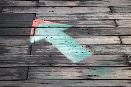 arrow on wooden floor showing the directionの写真素材