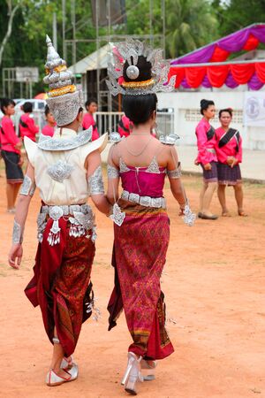 PAYAKKAPHUMPHISAI, MAHASARAKHAM - MAY 19 : Unidentified paraders are in traditional north-east Thai sky rocket ceremony and festival on May 19, 2012 at football playground, Payakkaphumphisai, Mahasarakham, Thailand.のeditorial素材
