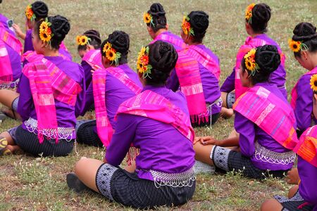 PAYAKKAPHUMPHISAI, MAHASARAKHAM - MAY 19 : Unidentified dancers are waiting to perform in traditional north-east Thai sky rocket ceremony and festival on May 19, 2012 at footbal playground, Payakkaphumphisai, Mahasarakham, Thailand.のeditorial素材