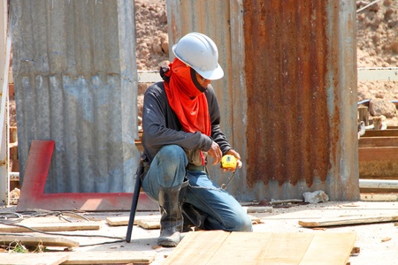 MUANG, BURIRAM - JUNE 9 : Unidentified man is working in the building site on June 9, 2012 at...