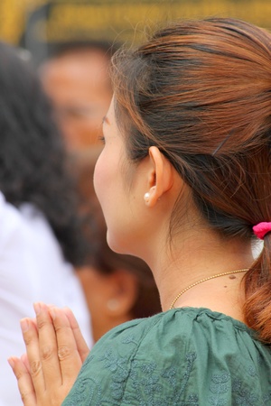 MUANG, MAHASARAKHAM - JUNE 16 : Unidentified woman is in worship the shrine of city pillar on June 16, 2012 at The shrine of city pillar, Muang, Mahasarakham, Thailand.のeditorial素材