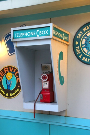 EVERLAND, YONGIN, KOREA - NOVEMBER 26 : The old style telephone box is located on wooden wall on November 26, 2011 at Everland, Yongin, Korea.のeditorial素材