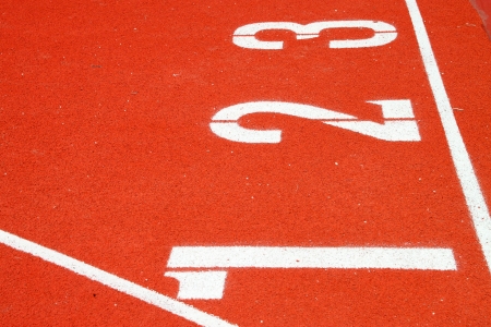 Numbers on running tracks of athletics in central public stadium, Mahasarakham, Thailand