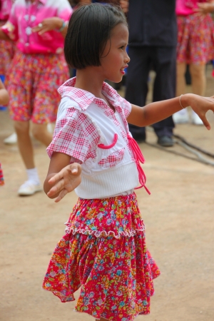 TA TUM VILLAGE, MUANG, MAHASARAKHAM - JULY 31 : Unidentified dancer is performing ancient circle  dance (Ram Wong) in Agricultural Clinic Project on July 31, 2012 at Ta Tum temple, Muang, Mahasarakham, Thailand.のeditorial素材