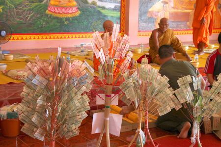 MUANG, MAHASARAKHAM - AUGUST 2 : Unidentified Buddhists are in activities of Buddhist Lent festival on August 2, 2012 at Wat Pa Samoson, Muang, Mahasarakham, Thailand.のeditorial素材