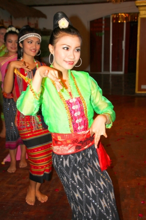 VIENTIANE, LAO P.D.R. - MAY 21 : Unidentified women are performing Lao dance on May 21, 2012 at KM 4 Riverside Restaurant - Karaoke, Vientiane, Lao P.D.R.のeditorial素材