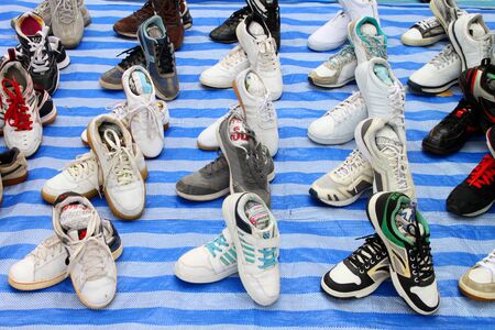 MUANG, MAHASARAKHAM - JULY 28 : Pile of shoes for customers to buy from hawkers on July 28, 2012 at new province hall, Mahasarakham, Thailand.のeditorial素材