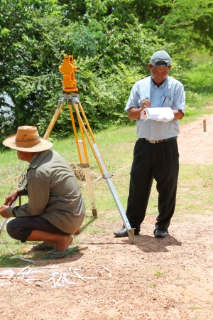MUANG, MAHASARAKHAM - SEPTEMBER 10 : Unidentified men are surveying location area to build a big dam on September 10, 2012 at local reservoir, Bua Kor, Muang, Mahasarakham, Thailand.のeditorial素材
