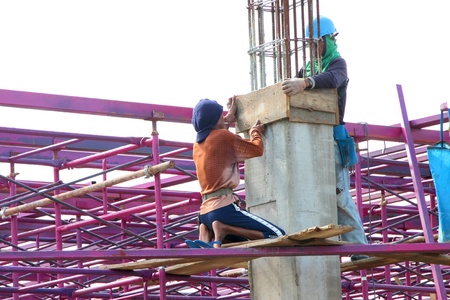 MUANG, BURIRAM - SEPTEMBER 23 : Unidentified men are working in the building site on September 23,...