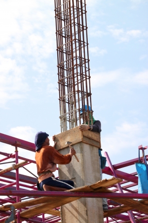 MUANG, BURIRAM - SEPTEMBER 23 : Unidentified men are working in the building site on September 23, 2012 at Taweekit Plaza, Muang, Buriram, Thailand.のeditorial素材
