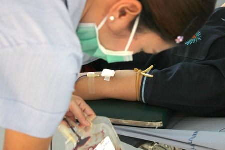 MUANG, MAHASARAKHAM - OCTOBER 26 : Unidentified sacrificers are in blood donation activities on October 26, 2012 at Padung Nari school hall, Muang, Mahasarakham, Thailand.のeditorial素材