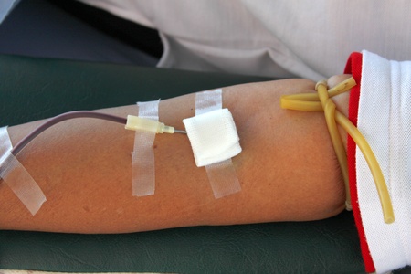 Arm of sacrificers in blood donation and one of activities of Red Cross in Thailandのeditorial素材