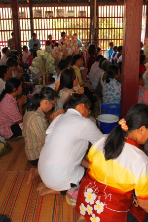 MUANG, MAHASARAKHAM - NOVEMBER 9 : Unidentified Buddhists are making religious ceremony  in which yellow robes and money are presented to the priests at the end of Buddhist Lent on November 9, 2012 at Nong Whai temple, Tha Tum District, Muang, Mahasarakhaのeditorial素材
