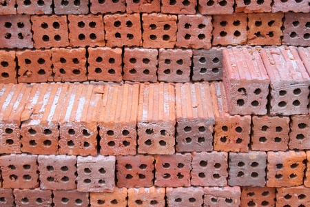 Orderly pile of construction red baked clay bricksの写真素材