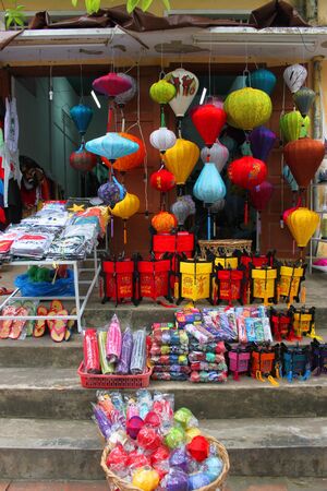 Souvenirs, shopping and trading center on walking street and cycling of world heritage old town on December 8, 2012 at Hoi An, Vietnam. So wonderful with old aged traditionally kept cultural activities, habits and customs, Hoai An town is now a wonderful のeditorial素材