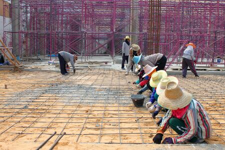 MUANG, BURIRAM - JANUARY 26 : Unidentified workers are working on construction site on January 26, 2013 at Taweekit Plaza Supermarket, Muang, Buriram, Thailand.のeditorial素材