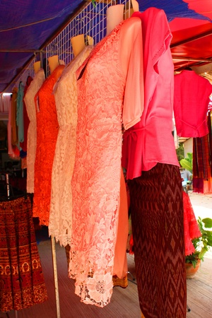 NADUN, MAHASARAKHAM - JANUARY 27 : Colorful clothes are placed for sales on January 27, 2013 at Nadun Pagoda shopping center, Nadun, Mahasarakham, Thailand.のeditorial素材