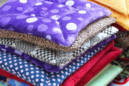 Pile of colorful clothes for sales on open market